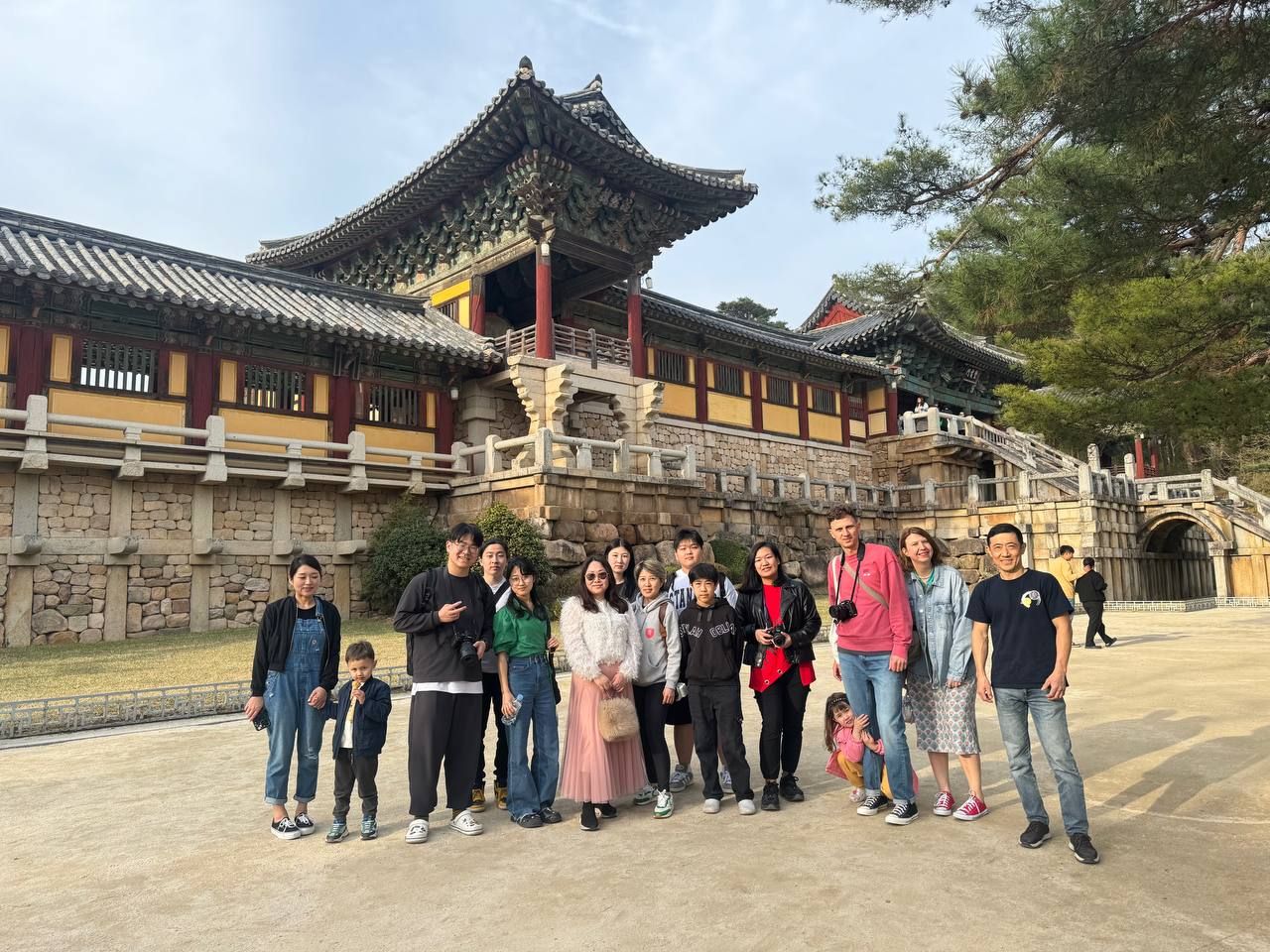 CIPcity community members gathered in front of a traditional Korean temple